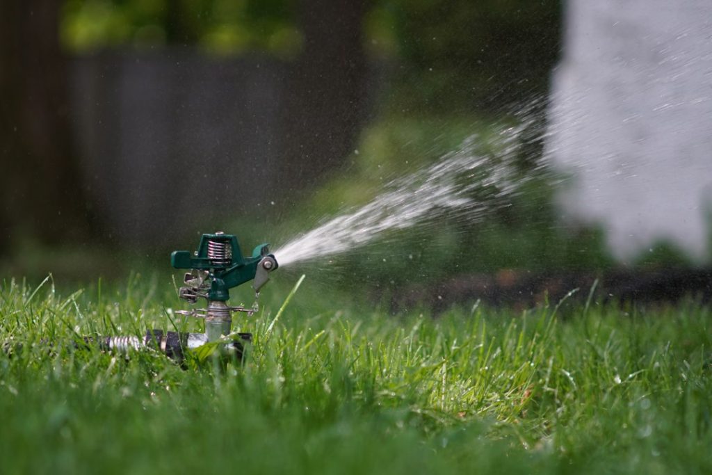 Lawn sprinkler running during a residential spring irrigation start-up