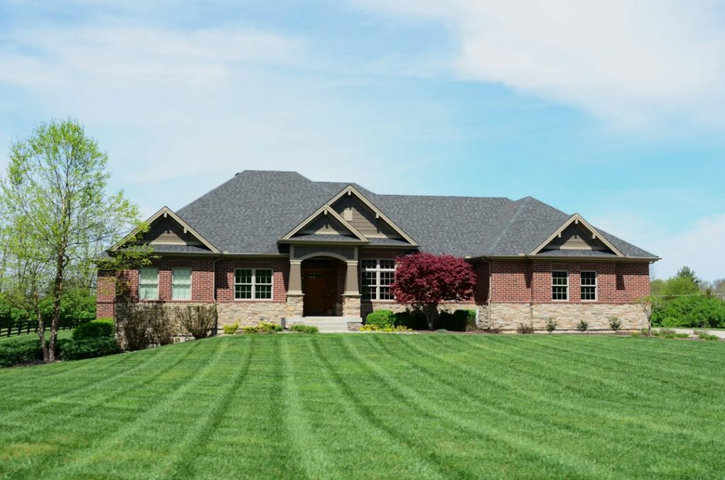 Attractive residential home and lawn representing Hunter irrigation controller troubleshooting